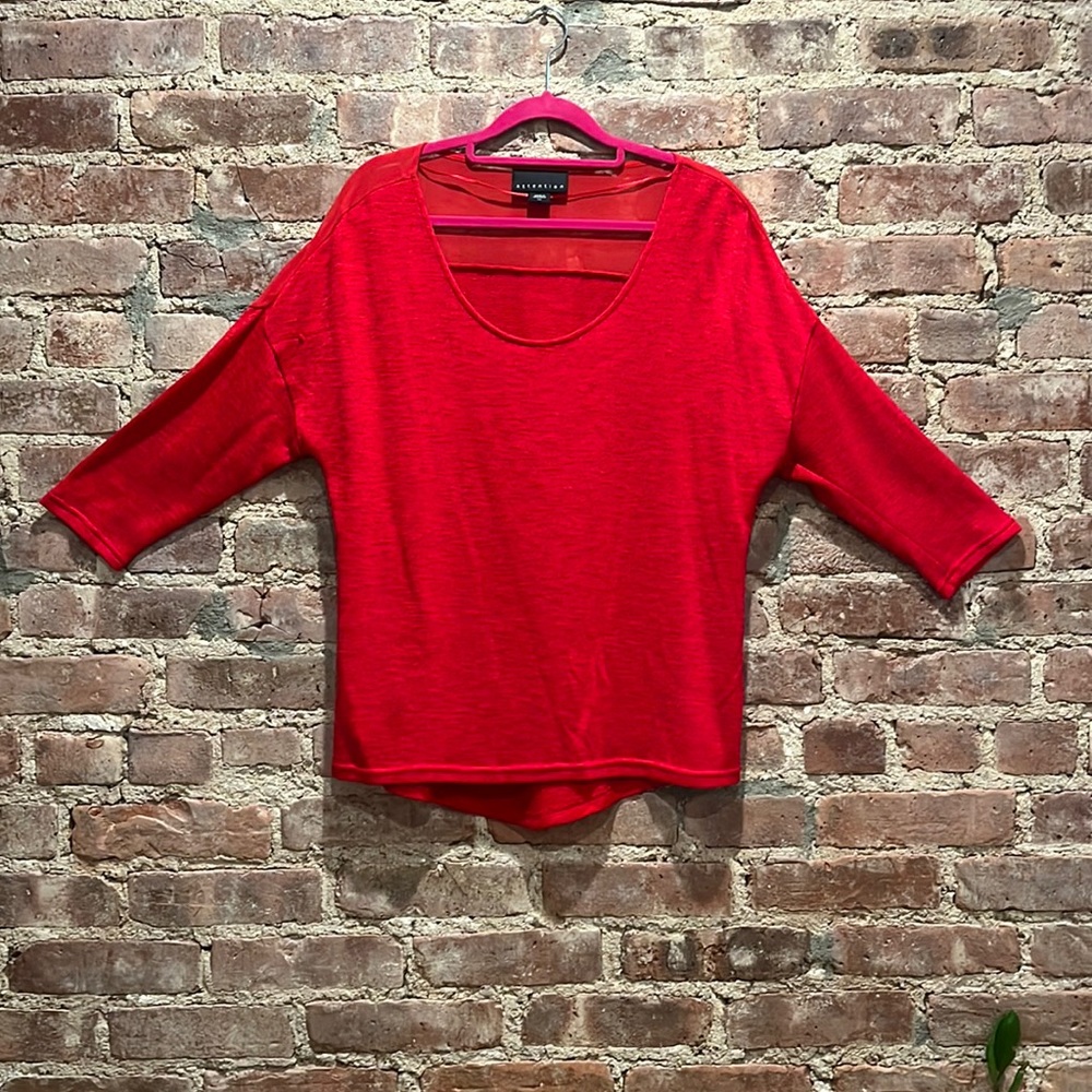 Red shirt with red mesh shoulder.